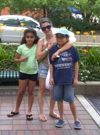 Mai with her two children in downtown Fort Collins